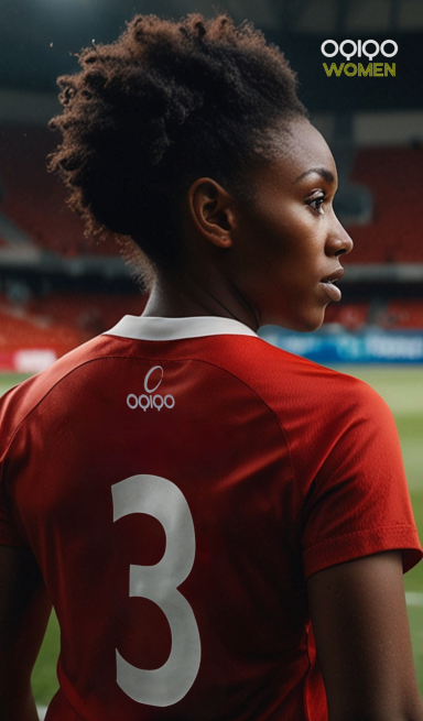 Jugadora de fútbol de espaldas, lleva una camiseta roja con el número 3.